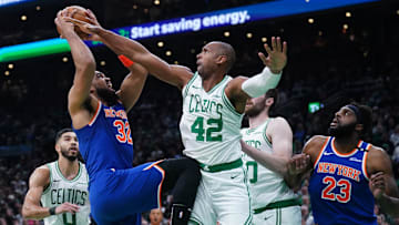 May 5, 2025; Boston, Massachusetts, USA; New York Knicks center Karl-Anthony Towns (32) shoots the ball against Boston Celtics center Al Horford (42) in the first quarter during game one of the second round for the 2025 NBA Playoffs at TD Garden. Mandatory Credit: David Butler II-Imagn Images