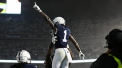 Penn State Nittany Lions wide receiver KeAndre Lambert-Smith celebrates a touchdown during a college football game.