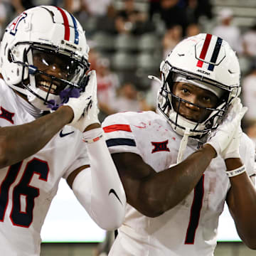 Aug 31, 2024; Tucson, Arizona, USA; Arizona Wildcats running back Jacory Croskey-Merritt (1) celebrates touchdown with Arizona Wildcats wide receiver Chris Hunter (16) during fourth quarter at Arizona Stadium