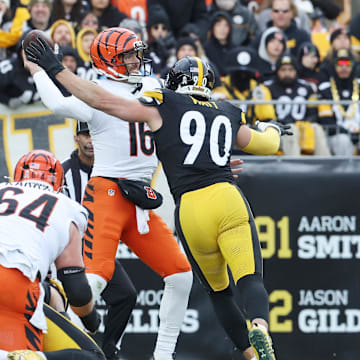 Nov 16, 2025; Pittsburgh, Pennsylvania, USA; Cincinnati Bengals quarterback Joe Flacco (16) looks to pass the ball as Pittsburgh Steelers linebacker T.J. Watt (90) defends during the first half at Acrisure Stadium. Mandatory Credit: Charles LeClaire-Imagn Images