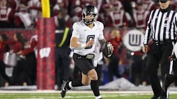 Nov 16, 2024; Madison, Wisconsin, USA;  Oregon Ducks quarterback Dillon Gabriel (8) looks to throw a pass during the third quarter against the Wisconsin Badgers at Camp Randall Stadium. Mandatory Credit: Jeff Hanisch-Imagn Images