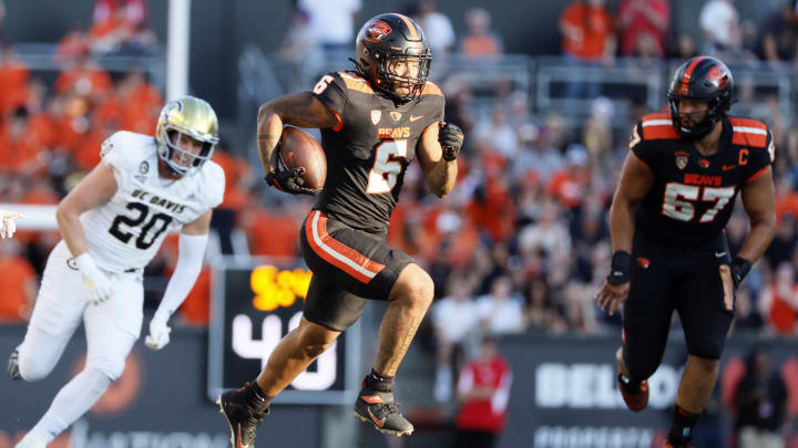 Sep 9, 2023; Corvallis, Oregon, USA; Oregon State Beavers running back Damien Martinez (6) runs with the ball for a touchdown during the first half against the UC Davis Aggies at Reser Stadium. Mandatory Credit: Soobum Im-USA TODAY Sports