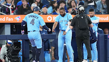 Toronto Blue Jays hitter George Springer celebrates with Vladimir Guerrero Jr. after a home run against the Athletics