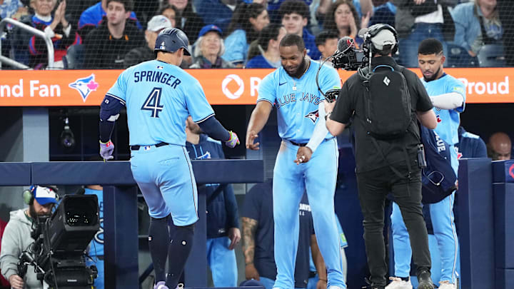Toronto Blue Jays hitter George Springer celebrates with Vladimir Guerrero Jr. after a home run against the Athletics Toronto Blue Jays hitter George Springer celebrates with Vladimir Guerrero Jr. after a home run against the Athletics