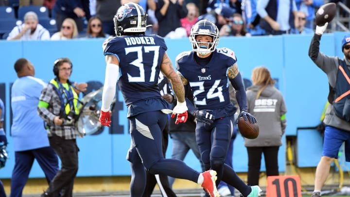 Dec 3, 2023; Nashville, Tennessee, USA; Tennessee Titans cornerback Elijah Molden (24) celebrates after recovering a fumble during the first half against the Indianapolis Colts at Nissan Stadium. Mandatory Credit: Christopher Hanewinckel-USA TODAY Sports