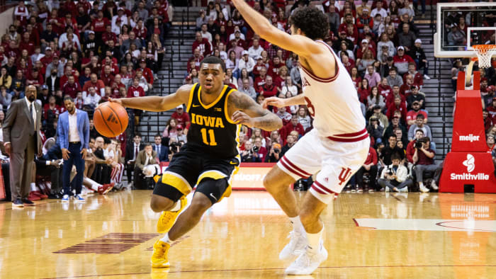 Jan 30, 2024; Bloomington, Indiana, USA; Iowa Hawkeyes guard Tony Perkins (11) dribbles the ball