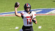 Nov 22, 2025; Dallas, Texas, USA; Louisville Cardinals quarterback Deuce Adams (13) throws the ball during the second half against the SMU Mustangs at Gerald J. Ford Stadium. Mandatory Credit: Jerome Miron-Imagn Images