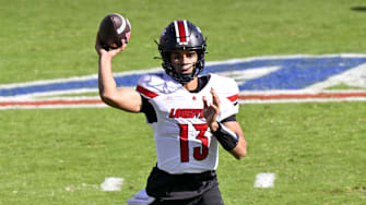 Nov 22, 2025; Dallas, Texas, USA; Louisville Cardinals quarterback Deuce Adams (13) throws the ball during the second half against the SMU Mustangs at Gerald J. Ford Stadium. Mandatory Credit: Jerome Miron-Imagn Images