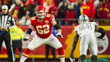Nov 29, 2024; Kansas City, Missouri, USA; Kansas City Chiefs guard Joe Thuney (62) looks to block against Las Vegas Raiders defensive end K'Lavon Chaisson (44) during the second half at GEHA Field at Arrowhead Stadium. Mandatory Credit: Jay Biggerstaff-Imagn Images