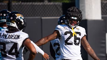 Jacksonville Jaguars safety Antonio Johnson (26) gives a teammate a high-five during an NFL training camp seventh session at the Miller Electric Center, Thursday, July 31, 2025, in Jacksonville, Fla. 