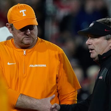 Tennessee head coach Josh Heupel shanks hands with Georgia head coach Kirby Smart before the start of a NCAA college football game against Tennessee in Athens, Ga., on Saturday, Nov. 16, 2024.