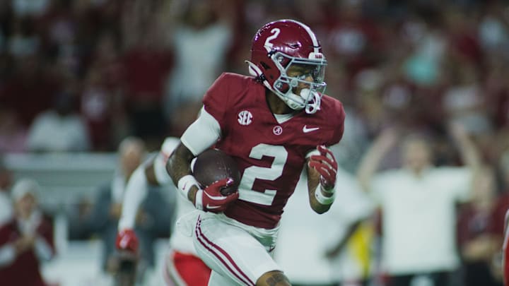 Aug 31, 2024; Tuscaloosa, Alabama, USA; Alabama Crimson Tide wide receiver Ryan Williams (2) carries the ball for a touchdown against the Western Kentucky Hilltoppers during the second quarter at Bryant-Denny Stadium. Mandatory Credit: Will McLelland-Imagn Images