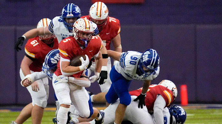 Kuemper Catholic’s Jarin Hoffman (5) carries the ball against the Van Meter Bulldogs Nov. 21, 2025 during the Class 2A high school state football championship at the UNI-Dome in Cedar Falls, Iowa.