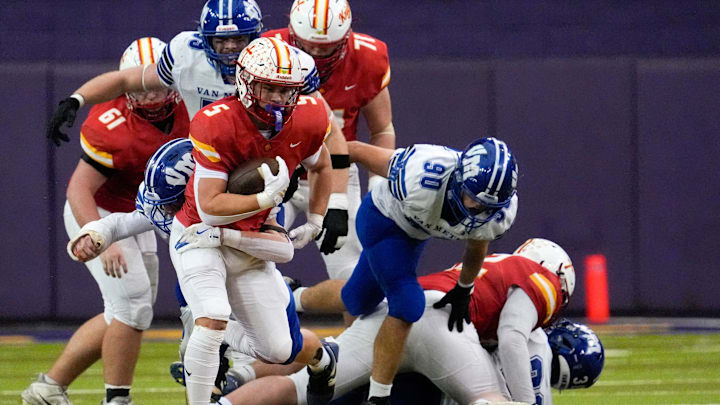Kuemper Catholic’s Jarin Hoffman (5) carries the ball against the Van Meter Bulldogs Nov. 21, 2025 during the Class 2A high school state football championship at the UNI-Dome in Cedar Falls, Iowa.