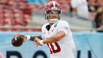 Dec 31, 2024; Tampa, FL, USA; Alabama Crimson Tide quarterback Austin Mack (10) throws the ball before a game against the Michigan Wolverines at Raymond James Stadium. Mandatory Credit: Matt Pendleton-Imagn Images