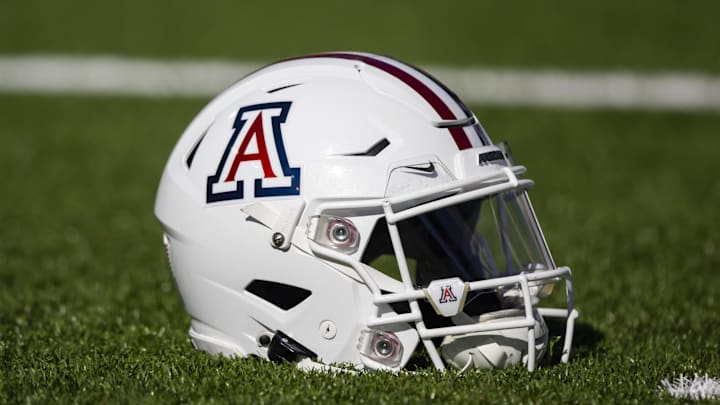 Nov 25, 2022; Tucson, Arizona, USA; Detailed view of an Arizona Wildcats helmet on the field during the Territorial Cup at Arizona Stadium. Mandatory Credit: Mark J. Rebilas-Imagn Images Nov 25, 2022; Tucson, Arizona, USA; Detailed view of an Arizona Wildcats helmet on the field during the Territorial Cup at Arizona Stadium. Mandatory Credit: Mark J. Rebilas-Imagn Images