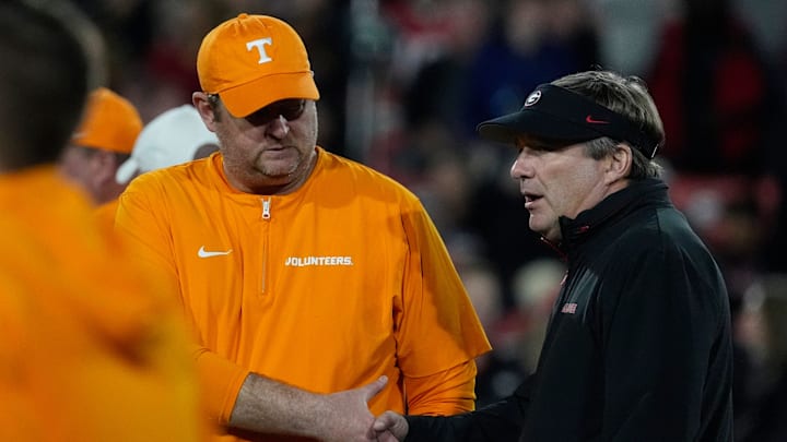 Tennessee head coach Josh Heupel shanks hands with Georgia head coach Kirby Smart before the start of a NCAA college football game against Tennessee in Athens, Ga., on Saturday, Nov. 16, 2024.