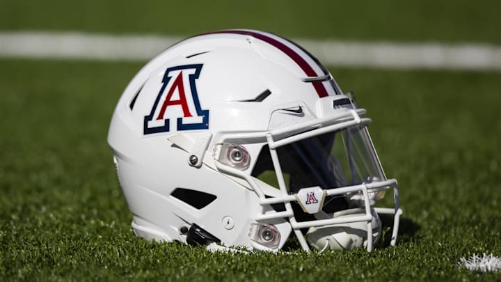 Nov 25, 2022; Tucson, Arizona, USA; Detailed view of an Arizona Wildcats helmet on the field during the Territorial Cup at Arizona Stadium. Mandatory Credit: Mark J. Rebilas-Imagn Images Nov 25, 2022; Tucson, Arizona, USA; Detailed view of an Arizona Wildcats helmet on the field during the Territorial Cup at Arizona Stadium. Mandatory Credit: Mark J. Rebilas-Imagn Images
