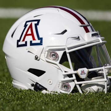 Nov 25, 2022; Tucson, Arizona, USA; Detailed view of an Arizona Wildcats helmet on the field during the Territorial Cup at Arizona Stadium. Mandatory Credit: Mark J. Rebilas-Imagn Images