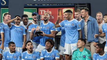 Sep 14, 2022; New York, NY, USA; New York City FC players celebrate with the trophy after defeating