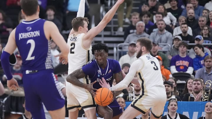 Mar 20, 2025; Providence, RI, USA; High Point Panthers forward Terry Anderson (0) loses control of the ball against Purdue Boilermakers guard Braden Smith (3) and guard Fletcher Loyer (2) during the first half at Amica Mutual Pavilion. Mandatory Credit: Gregory Fisher-Imagn Images