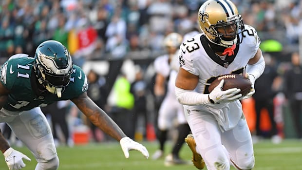 Saints cornerback Marshon Lattimore (23) intercepts a pass intended for Eagles receiver A.J. Brown (11) 