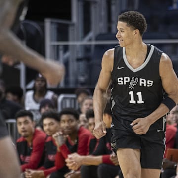 Jul 5, 2025; San Francisco, California, USA; San Antonio Spurs rookie Carter Bryant (11) jogs down the court after a 3-point shot against the Miami Heat at the 2025 California Classic at Chase Center.