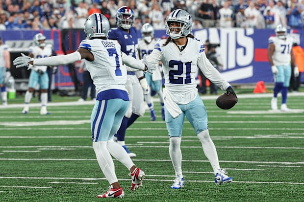 Dallas Cowboys CB Stephon Gilmore celebrates his interception with Trevon Diggs