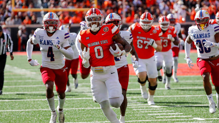 Oct 14, 2023; Stillwater, Oklahoma, USA; Oklahoma State's Ollie Gordon II (0) runs the ball in the second quarter for a touchdown against the Kansas Jayhawks at Boone Pickens Stadium. Mandatory Credit: Nathan J. Fish-USA TODAY Sports