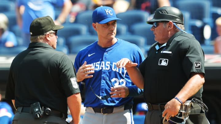 Aug 26, 2024; Cleveland, Ohio, USA; Kansas City Royals manager Matt Quatraro (33) talks with umpire Marvin Hudson, left, and umpire Hunter Wendelstedt during the fourth inning against the Cleveland Guardians at Progressive Field. Mandatory Credit: Ken Blaze-USA TODAY Sports