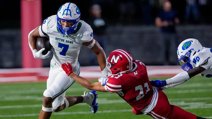 Green Bay Notre Dame's Kingston Allen (7) breaks a tackle by Neenah High School's Trevin Rettmann (23) on Friday, Aug. 21, 2026, at Neenah High School in Neenah, Wisconsin. Notre Dame won the game in overtime, 56-53.
Tork Mason/Green Bay Press-Gazette