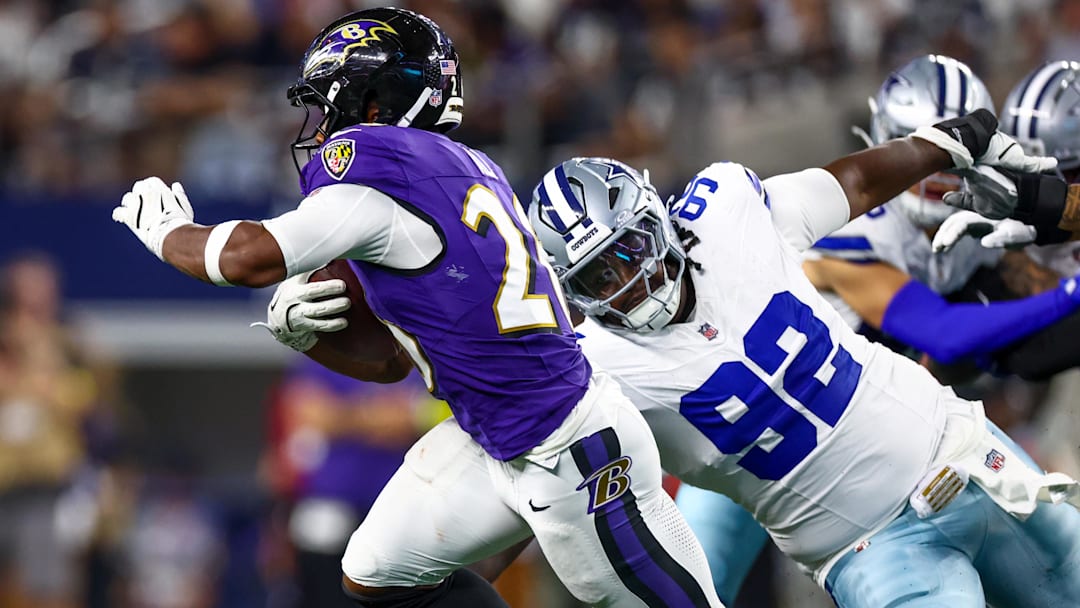 Baltimore Ravens running back Rasheen Ali (26) runs with the ball as Dallas Cowboys defensive tackle Tommy Akingbesote (92) defends during the second half at AT&T Stadium.