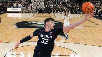 Mar 9, 2024; Providence, Rhode Island, USA; Connecticut Huskies center Donovan Clingan (32) grabs