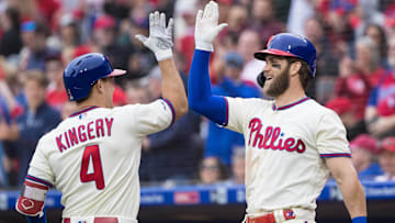 Former Philadelphia Phillies 2B Scott Kingery (4) celebrates with current 1B Bryce Harper (3) after hitting a solo home run during the fifth inning against the New York Mets at Citizens Bank Park.