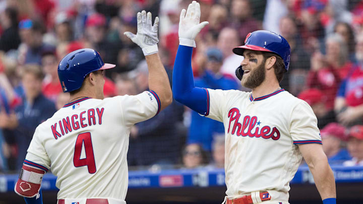 Former Philadelphia Phillies 2B Scott Kingery (4) celebrates with current 1B Bryce Harper (3) after hitting a solo home run during the fifth inning against the New York Mets at Citizens Bank Park.
