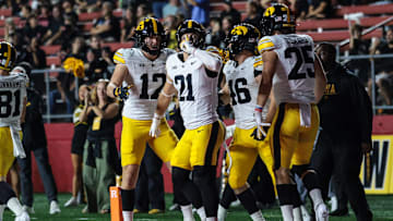 Sep 19, 2025; Piscataway, New Jersey, USA; Iowa Hawkeyes wide receiver Kaden Wetjen (21) celebrates with teammates after returning the opening kick off for a touchdown during the first quarter against the Rutgers Scarlet Knights at SHI Stadium. Mandatory Credit: Vincent Carchietta-Imagn Images