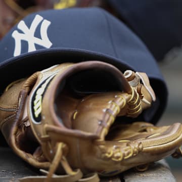Jul 28, 2014; Arlington, TX, USA; New York Yankees gloves and hats in the dugout during the game against the Texas Rangers at Globe Life Park in Arlington. Mandatory Credit: Kevin Jairaj-Imagn Images