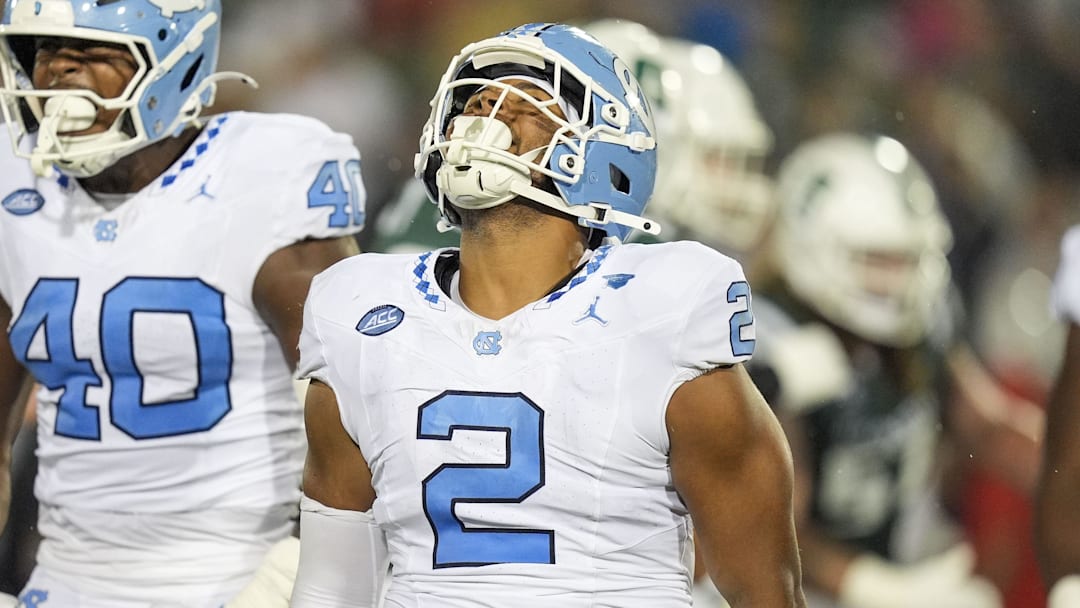 Sep 6, 2025; Charlotte, North Carolina, USA; North Carolina Tar Heels linebacker Andrew Simpson (2) celebtates his sack along with linebacker Tyler Thompson (40) during the second half against the Charlotte 49ers at Jerry Richardson Stadium. Mandatory Credit: Jim Dedmon-Imagn Images