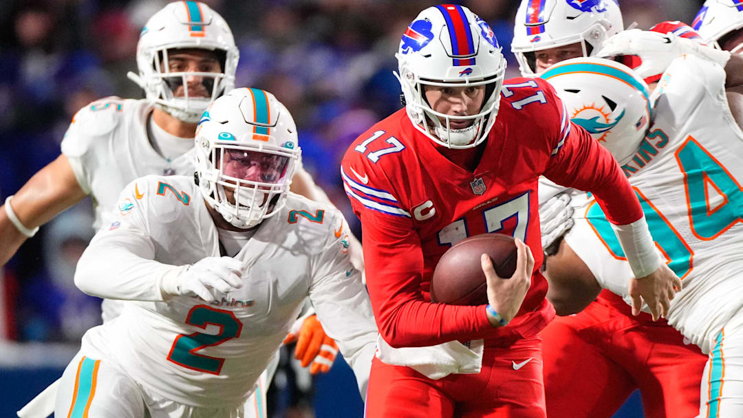 Buffalo Bills quarterback Josh Allen (17) runs with the ball against Miami Dolphins linebacker Bradley Chubb (2) during the second half at Highmark Stadium.