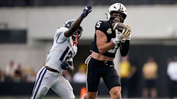 Vanderbilt wide receiver Richie Hoskins (5) receives a pass resulting in a touchdown past Utah State safety Bobby Arnold (12) during the third quarter at FirstBank Stadium in Nashville, Tenn., Saturday, Sept. 27, 2025.