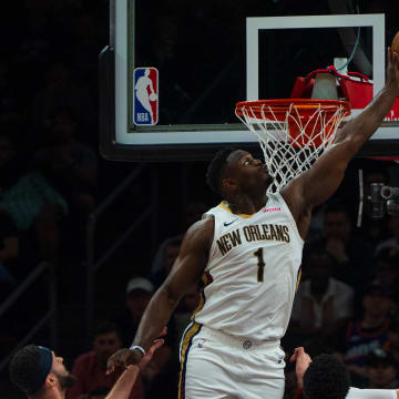 Apr 7, 2024; Phoenix, Arizona, USA;  New Orleans Pelicans forward Zion Williamson (1) blocks the shot of Phoenix Suns center Jusuf Nurkic (20) during the first half at Footprint Center