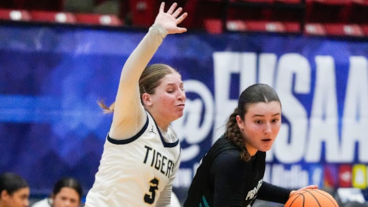 Savannah Schultz of Holy Trinity guards Kennedy Loux of Providence School in the state Class 2A girls basketball semifinals Thursday, February 27, 2025. Craig Bailey/FLORIDA TODAY via USA TODAY NETWORK Savannah Schultz of Holy Trinity guards Kennedy Loux of Providence School in the state Class 2A girls basketball semifinals Thursday, February 27, 2025. Craig Bailey/FLORIDA TODAY via USA TODAY NETWORK