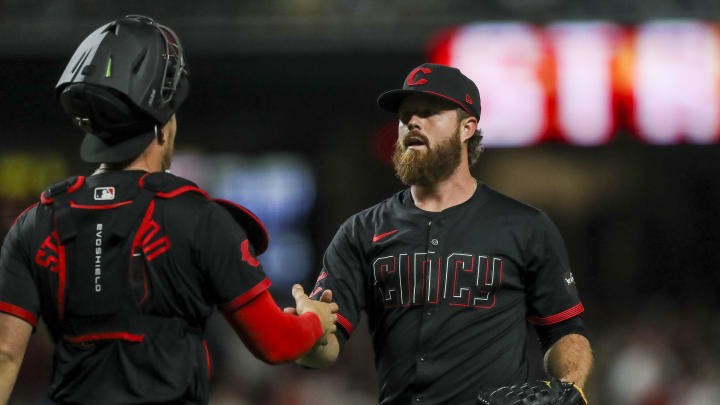 Apr 19, 2024; Cincinnati, Ohio, USA; Cincinnati Reds relief pitcher Buck Farmer (46) shakes hands with catcher Tyler Stephenson (37) after the victory over the Los Angeles Angels at Great American Ball Park. Mandatory Credit: Katie Stratman-USA TODAY Sports