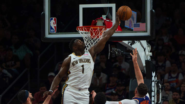 Apr 7, 2024; Phoenix, Arizona, USA;  New Orleans Pelicans forward Zion Williamson (1) blocks the shot of Phoenix Suns center Jusuf Nurkic (20) during the first half at Footprint Center