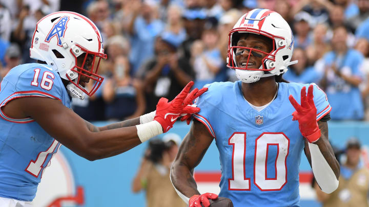 Oct 29, 2023; Nashville, Tennessee, USA; Tennessee Titans wide receiver DeAndre Hopkins (10) celebrates with wide receiver Treylon Burks (16) after his third touchdown of the game during the second half against the Atlanta Falcons at Nissan Stadium. Mandatory Credit: Christopher Hanewinckel-USA TODAY Sports