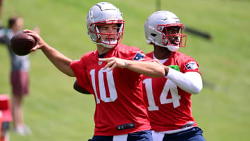 Jun 12, 2024; Foxborough, MA, USA;  New England Patriots quarterback Drake Maye (10) and quarterback Jacob y Brissett (14)  throw passes at minicamp at Gillette Stadium.  Mandatory Credit: Eric Canha-USA TODAY Sports