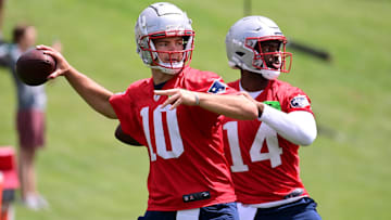 New England Patriots quarterback Drake Maye (10) and quarterback Jacoby Brissett (14)  throw passes at minicamp at Gillette Stadium.  