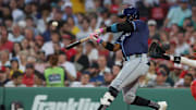 Jun 11, 2025; Boston, Massachusetts, USA; Tampa Bay Rays designated hitter Yandy Diaz (2) hits a two run home run during the fifth inning against the Boston Red Sox at Fenway Park. Mandatory Credit: Paul Rutherford-Imagn Images