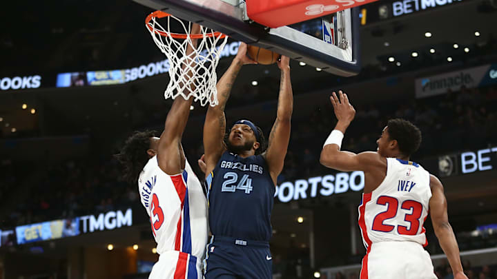 Apr 5, 2024; Memphis, Tennessee, USA; Memphis Grizzlies forward Lamar Stevens (24) drives to the basket between Detroit Pistons center James Wiseman (13) and guard Jaden Ivey (23): Petre Thomas-Imagn Images