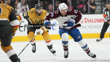 Oct 9, 2024; Las Vegas, Nevada, USA; Colorado Avalanche right wing Logan O’Connor (25) skates ahead of Vegas Golden Knights center Nicolas Roy (10) during the first period at T-Mobile Arena. Mandatory Credit: Lucas Peltier-Imagn Images
